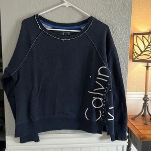 Navy with white lettering down one side of the sweatshirt, size L  Calvin Klein